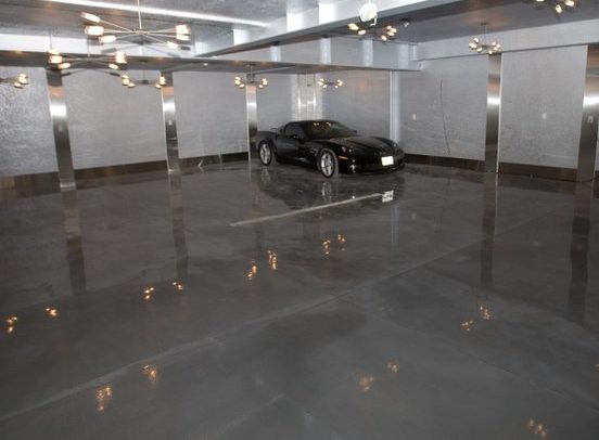 a black car in a garage coated with concrete flooring in Prairieville, LA