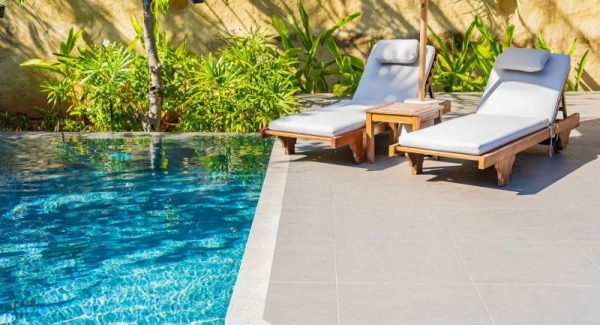 2 chairs on pool deck surface coated with cool feel flooring in Prairieville, LA