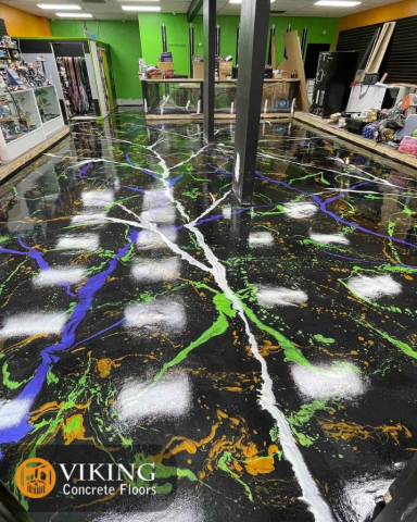 Metallic Flooring with black base and orange, green and purple splatter in & near  Prairieville, LA
