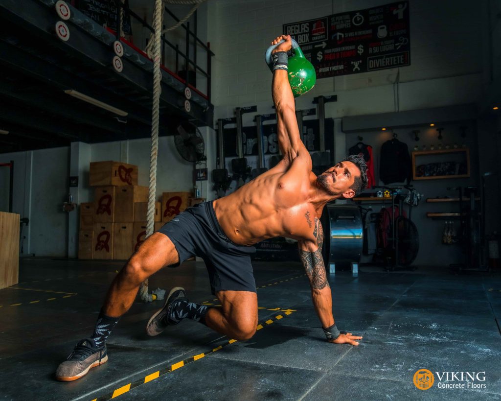 a man working out on rubberized garage gym flooring in Prairieville, LA
