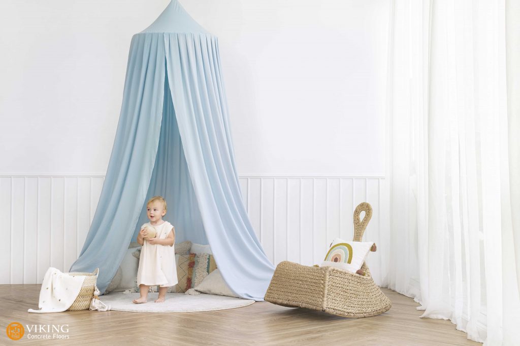 A babay playing on a safe flooring forkid's bedroom in & near Prairieville