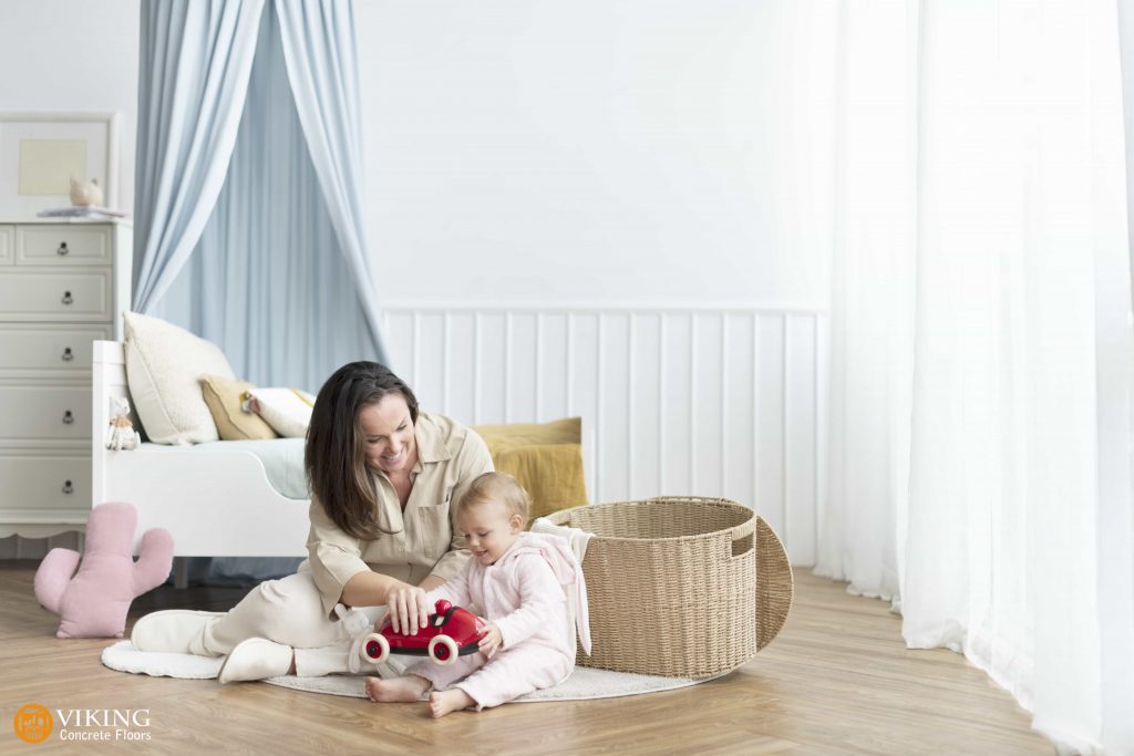 A mother & baby playing on safe flooring in & near Prairieville