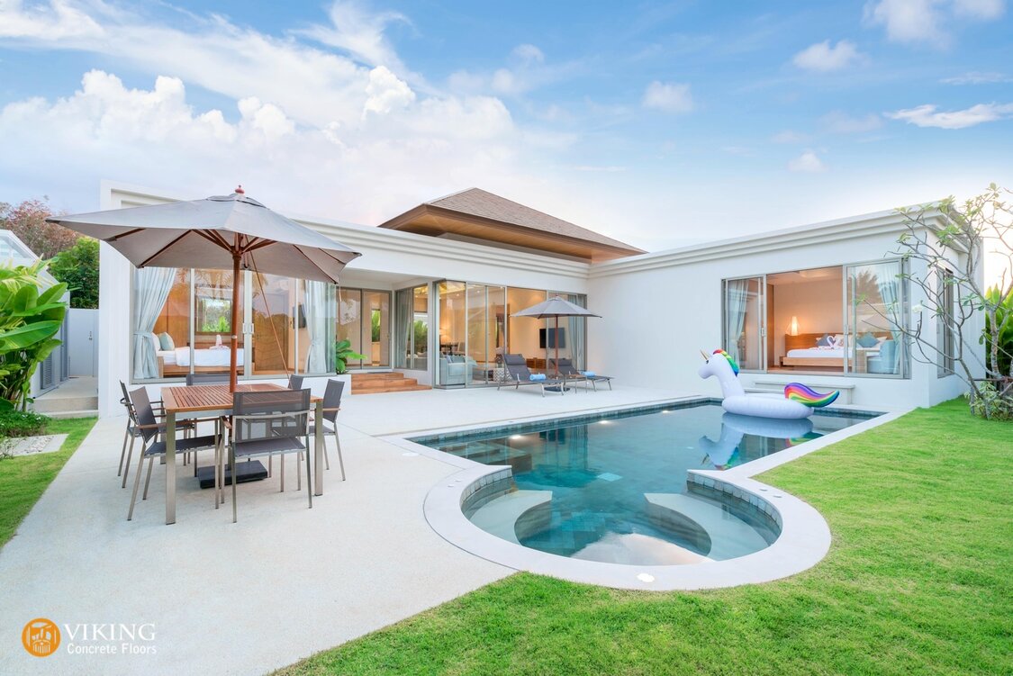 Prairieville house with patio and pool deck coverd by concrete flooring