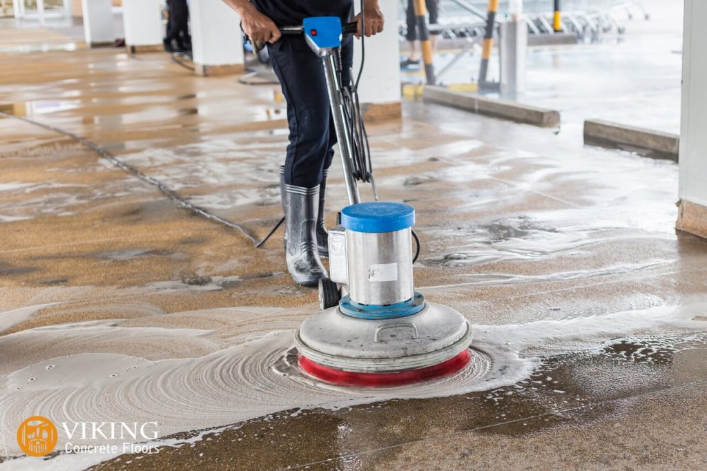 A man cleaning epoxy garage flooring in & near Prairieville, LA