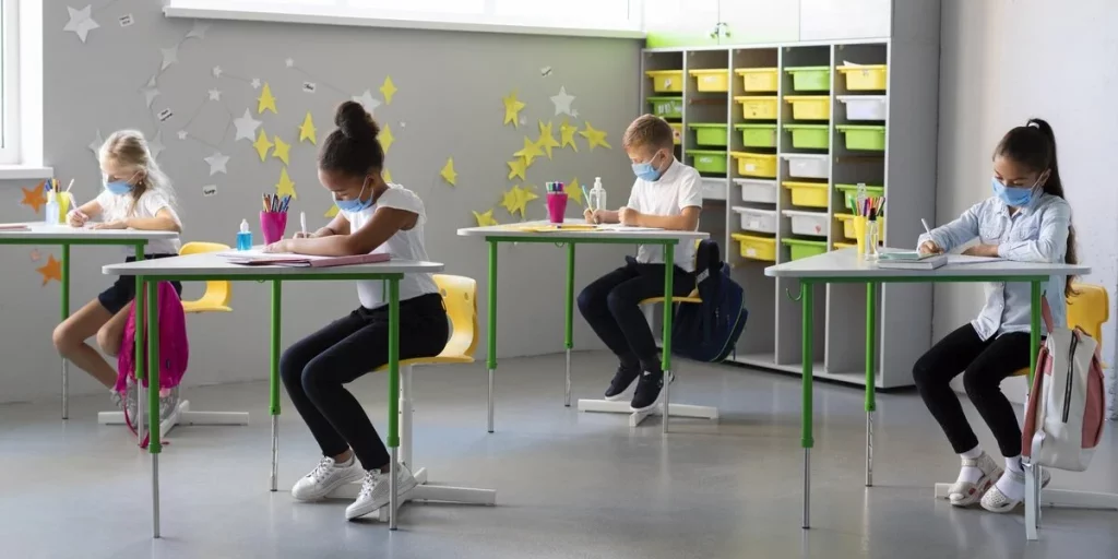 Children taking exam in class with polished concrete flooring